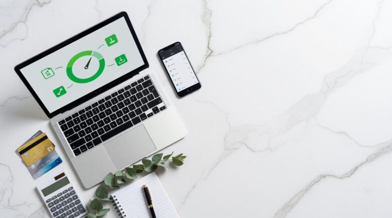 Person checking their credit score for free on a smartphone in 2026