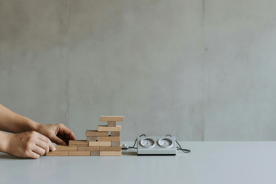 A person reviewing an updated credit report on a laptop showing improved score numbers