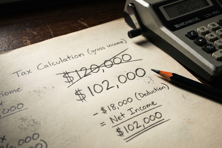 Diagram comparing SE tax versus income tax burden for a $120K freelancer after deductions