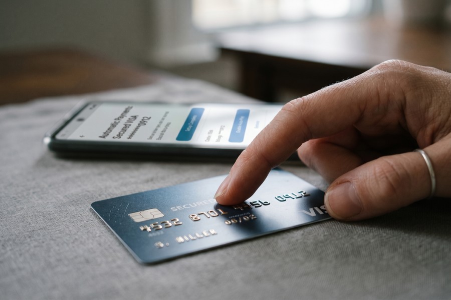Credit score meter rising upward symbolizing post-divorce credit rebuilding progress