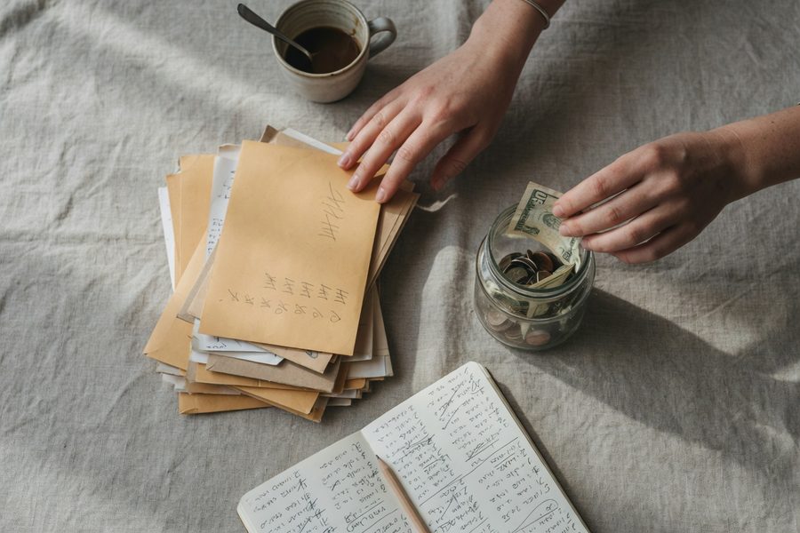 Splitting a paycheck into savings and debt payments.