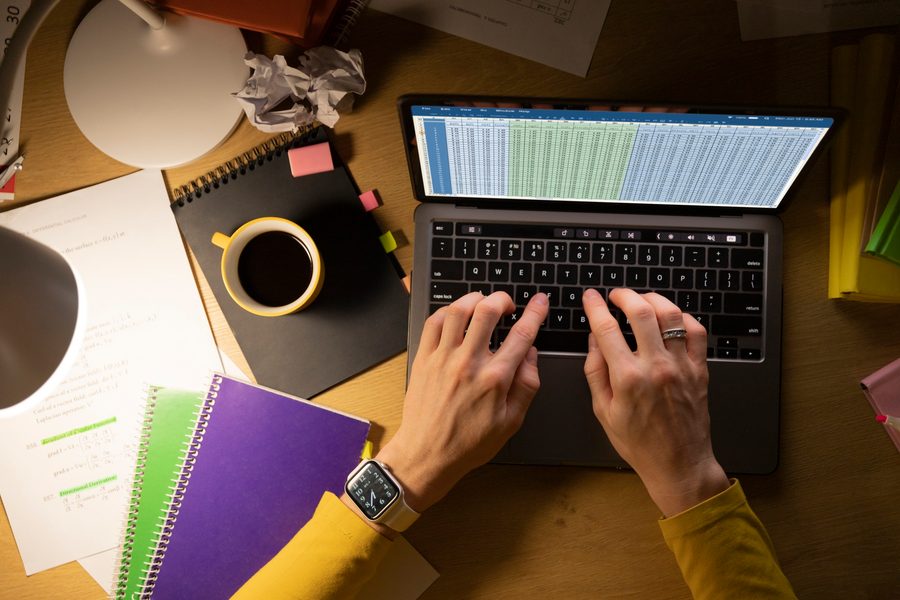 Visual: A young professional in Jersey City using a budgeting app to track monthly savings toward their $2,500 goal.