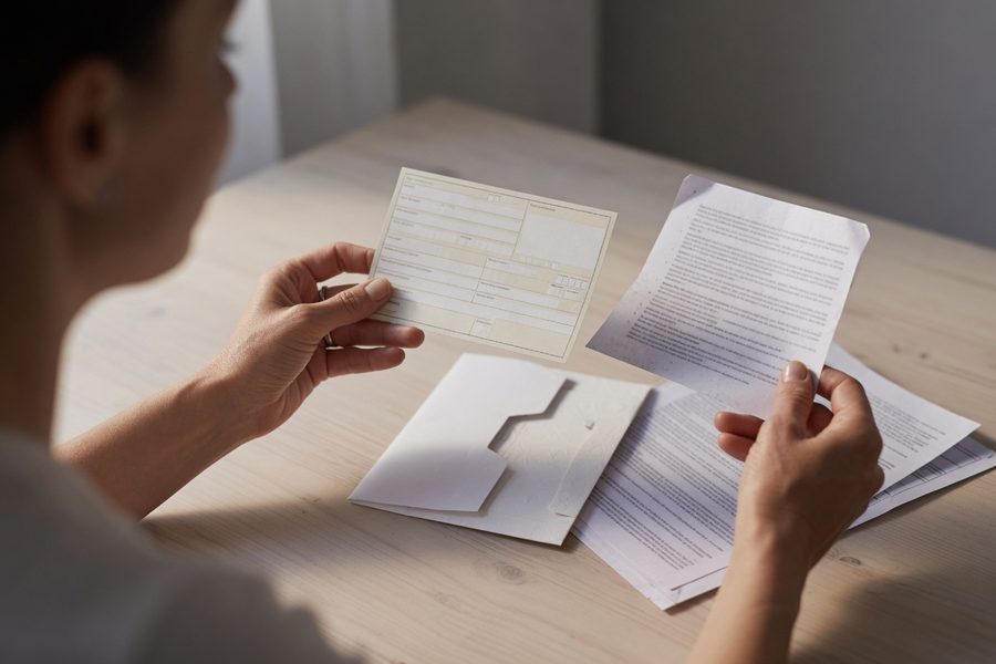Tenant signing a lease after a credit score rental application approval