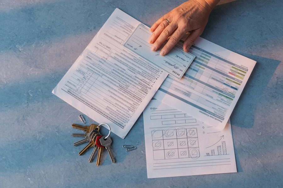 Stack of cash in a high-yield savings account statement on a desk