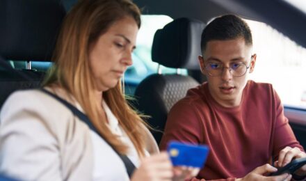 First-time car buyer reviewing auto loan options while monitoring credit score impact