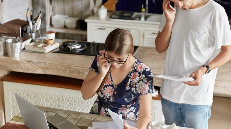 First-time homeowner reviewing tax deductions and documents at desk