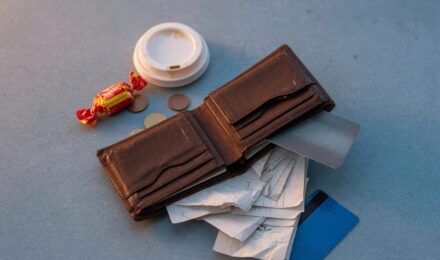 Spread of small everyday purchases including coffee, delivery app orders, and quick convenience items on a table