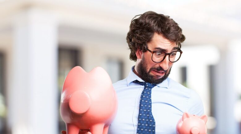 Person setting up automatic savings to build an emergency fund