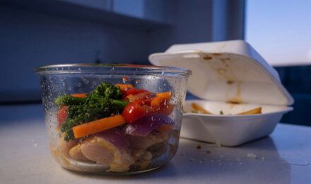 Side-by-side comparison of home-cooked meal ingredients versus restaurant plated food with price tags
