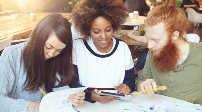 Young professional reviewing budget and financial plan at desk