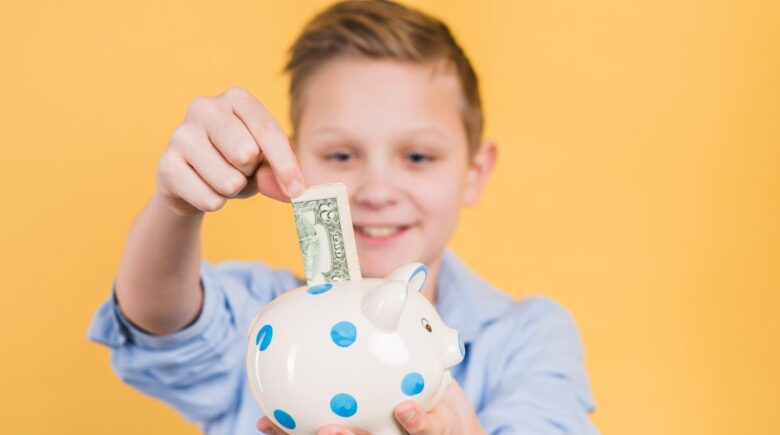 Three labeled piggy banks or jars for teaching children to save, spend, and share money