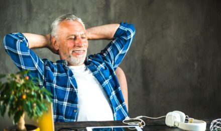 Man in his 50s reviewing retirement savings documents and financial plan at home