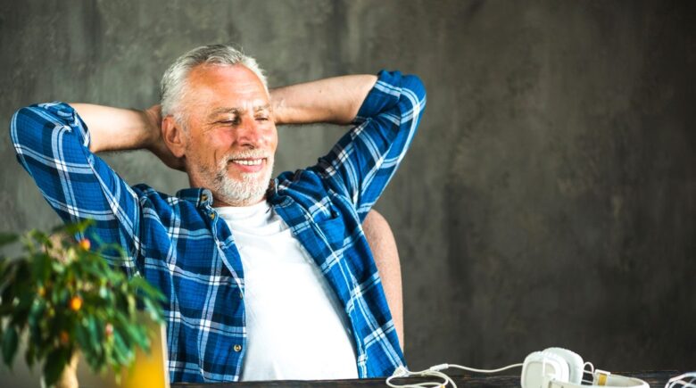 Man in his 50s reviewing retirement savings documents and financial plan at home