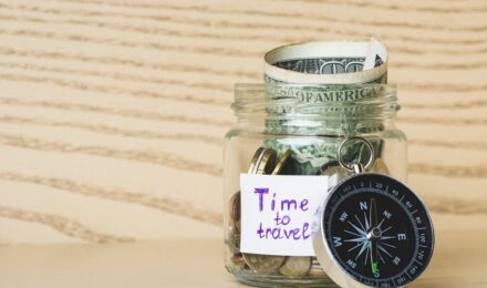Person planning a sabbatical with a savings roadmap and calculator on a desk