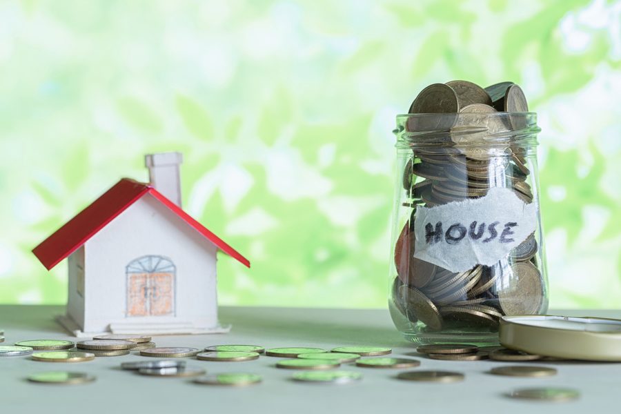Single-income household reviewing monthly budget at kitchen table