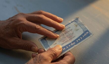 Older adult on phone call with warning symbol, illustrating common Social Security imposter scams