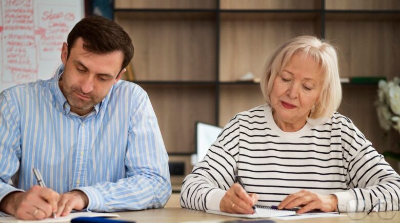 Teacher reviewing pension documents and retirement income plan at desk