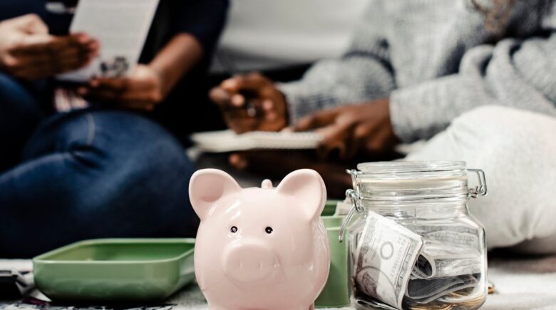 Person reviewing financial documents with a focus on savings vs investments