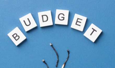 A person reviewing their budget and avoiding hidden fees in a financial management context