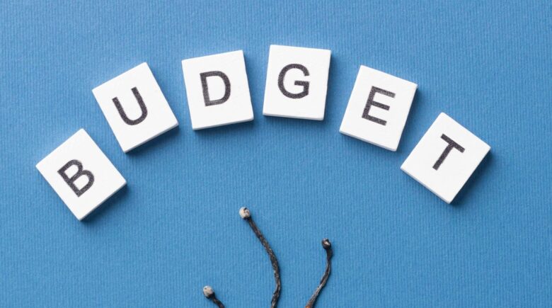 A person reviewing their budget and avoiding hidden fees in a financial management context