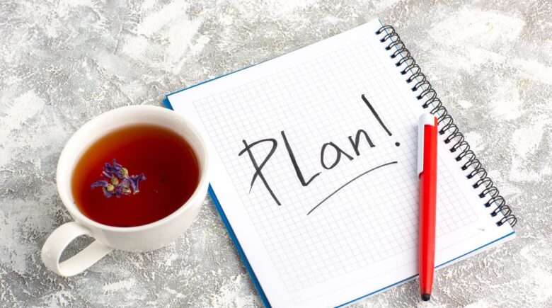 A person reviewing a budget plan for a $3,200 car repair, with a focus on monthly savings and financial planning.